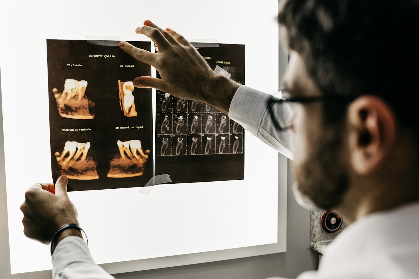 Dental assistant preparing a treatment room for a specialist appointment