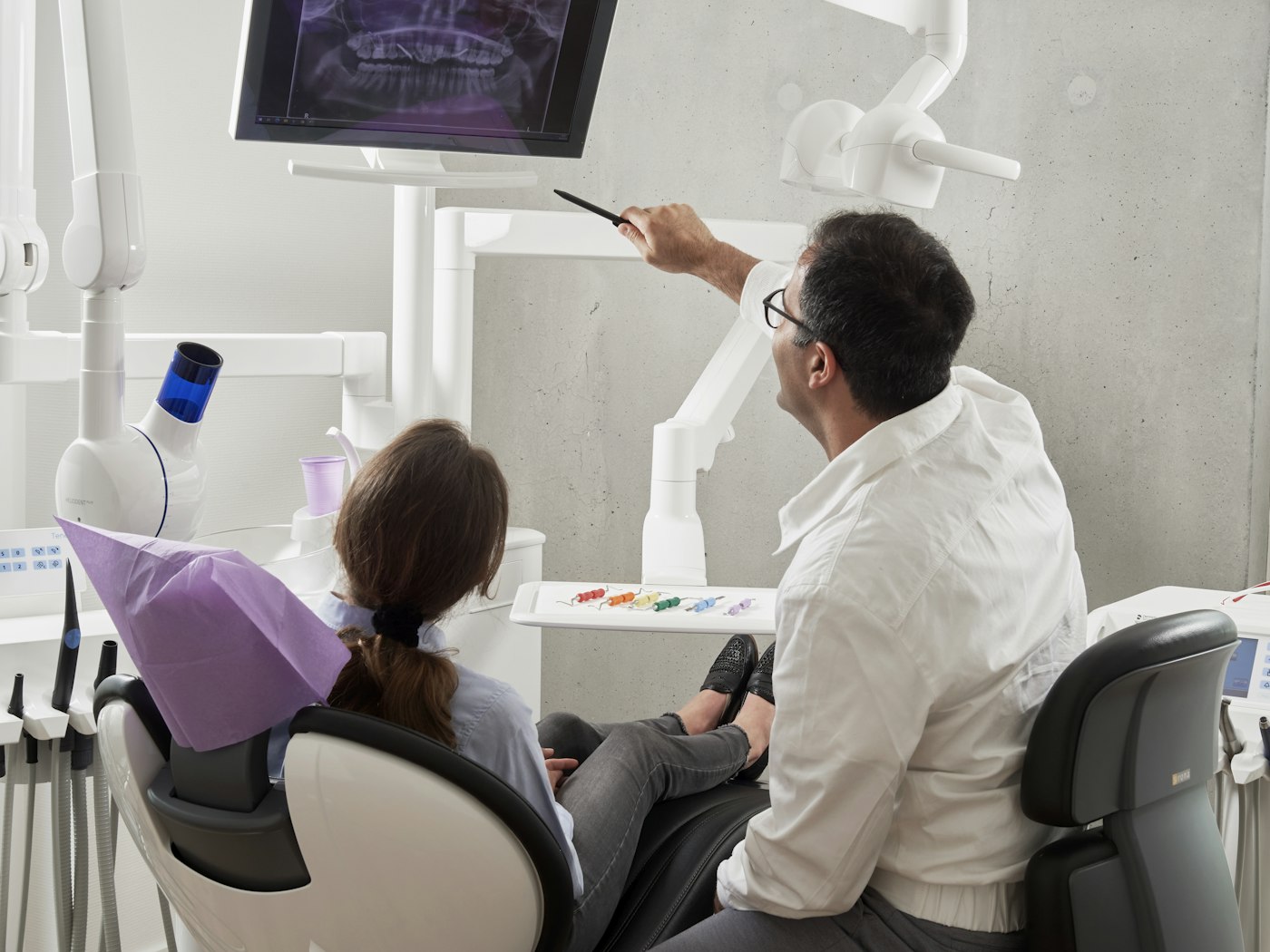 Dental assistant supporting a patient during a procedure