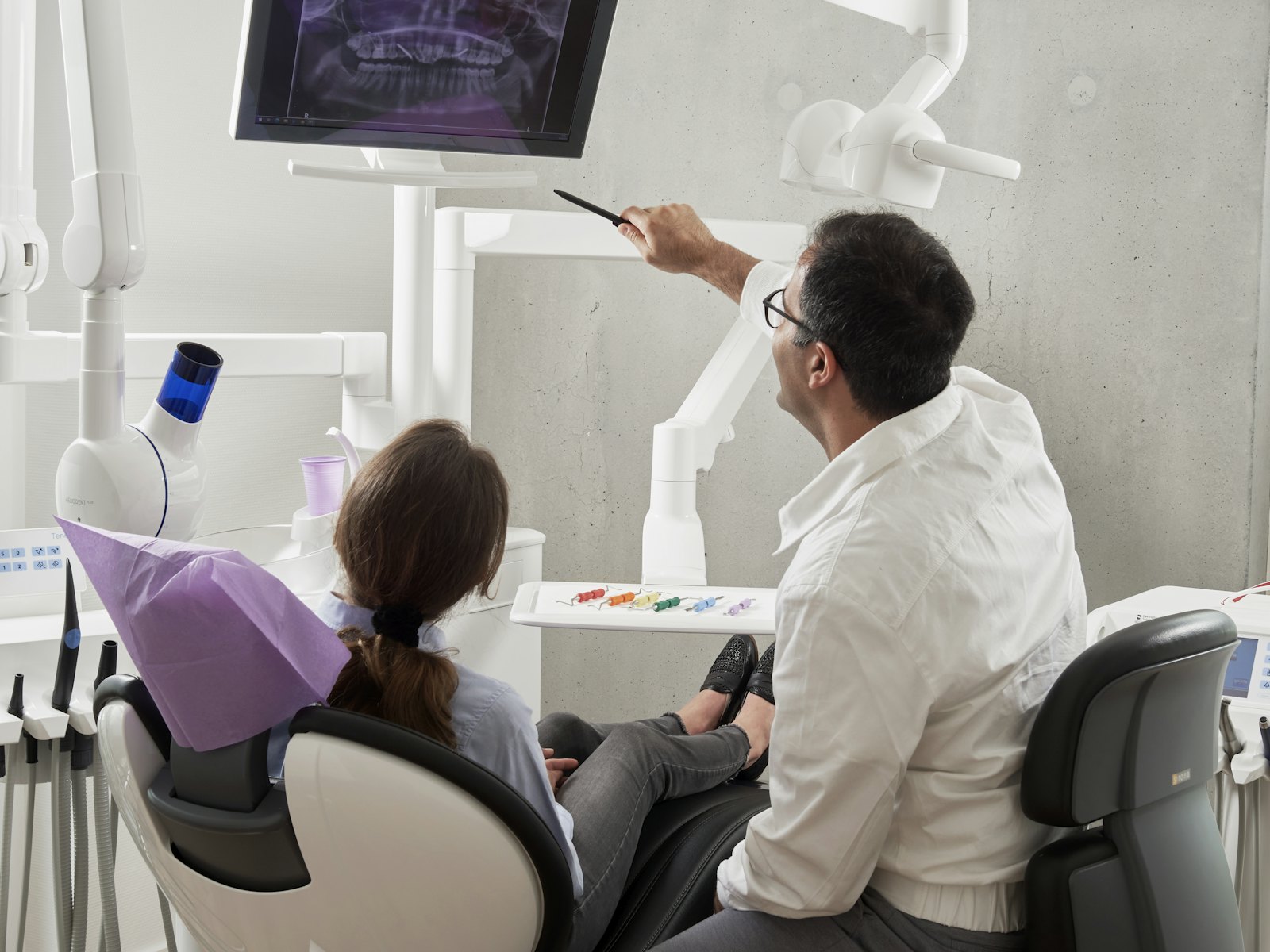 Dental assistant working chairside with dentist during a procedure